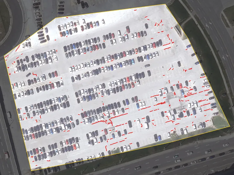 The same lot with the crack-like lines found by the software drawn in red.